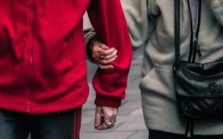 person wearing red jacket by Jack Finnigan courtesy of Unsplash.